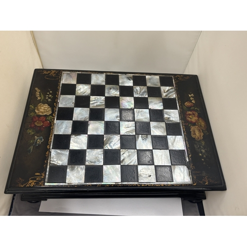 18 - A VICTORIAN EBONY GAMES BOX WITH AN INLAID MOTHER OF PEARL CHESS BOARD TO THE TOP AND BRIDGE PLAYING... 