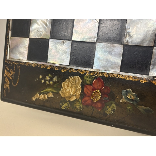 18 - A VICTORIAN EBONY GAMES BOX WITH AN INLAID MOTHER OF PEARL CHESS BOARD TO THE TOP AND BRIDGE PLAYING... 