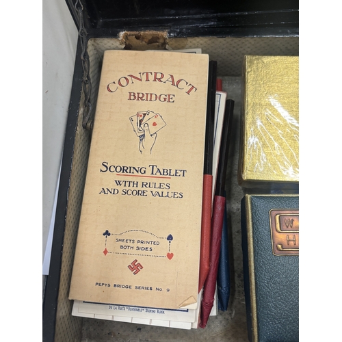 18 - A VICTORIAN EBONY GAMES BOX WITH AN INLAID MOTHER OF PEARL CHESS BOARD TO THE TOP AND BRIDGE PLAYING... 