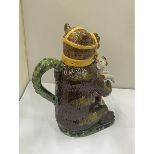 24 - A MAJOLICA STYLE BEAR JUG DEPICTING A CHAINED BEAR HOLDING A DOG, HEIGHT 29CM