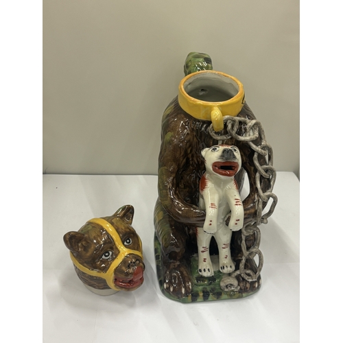 24 - A MAJOLICA STYLE BEAR JUG DEPICTING A CHAINED BEAR HOLDING A DOG, HEIGHT 29CM