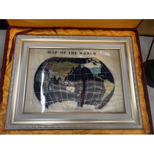 35 - A FRAMED MAP OF THE WORLD WITH BLUE LAPIS OCEAN AND OTHER SEMI-PRECIOUS STONES, 34CM X 45CM, IN PRES... 