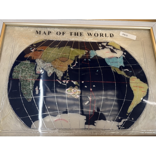 35 - A FRAMED MAP OF THE WORLD WITH BLUE LAPIS OCEAN AND OTHER SEMI-PRECIOUS STONES, 34CM X 45CM, IN PRES... 
