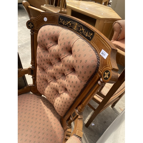 2617 - A VICTORIAN MAHOGANY LOUNGE CHAIR INSET WITH EBONISED PANELS AND FOLIATE DECORATION ON TURNED FRONT ... 