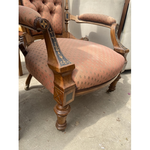 2617 - A VICTORIAN MAHOGANY LOUNGE CHAIR INSET WITH EBONISED PANELS AND FOLIATE DECORATION ON TURNED FRONT ... 
