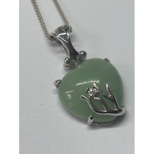 614 - A SILVER NECKALCE WITH A JADE HEART SHAPED PENDANT IN A PRESENTATION BOX`