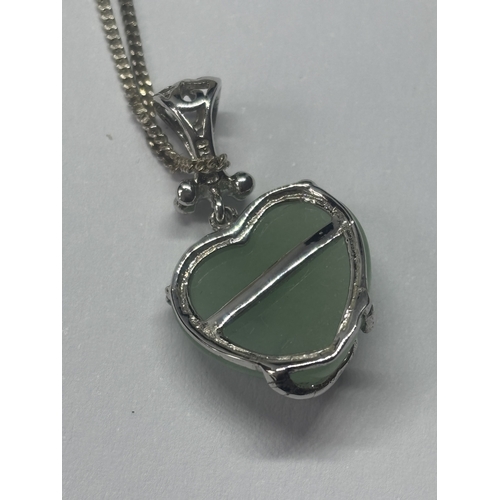 614 - A SILVER NECKALCE WITH A JADE HEART SHAPED PENDANT IN A PRESENTATION BOX`