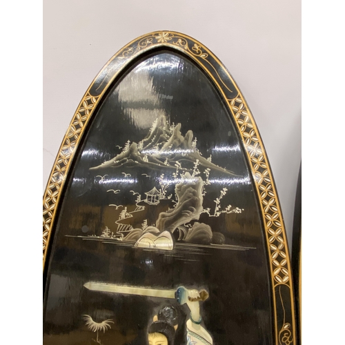 15 - A PAIR OF CHINOISERIE  BLACK LACQUER DECORATED WALL PANELS DEPICTING LADY WARRIORS WITH OVERLAID MOT... 