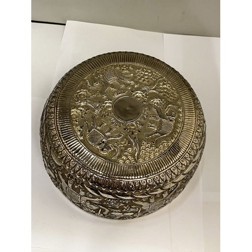25 - A CAMBODIAN WHITE METAL BOWL WITH REPOUSSE DECORATION FIGURAL WITH ELEPHANTS AND FOLIATE SCROLLWORK ... 