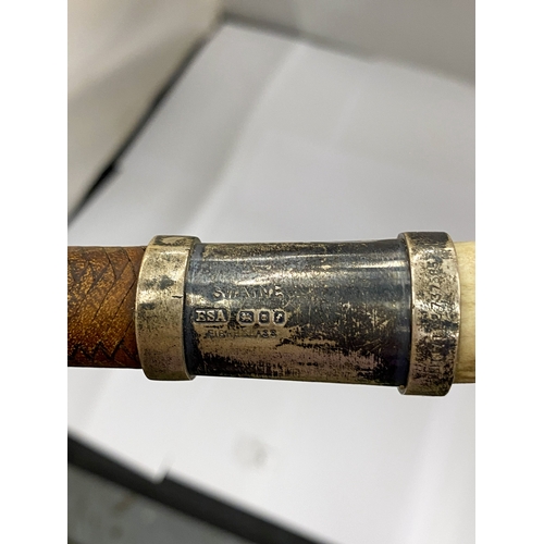 5 - A VINTAGE ENGLISH RIDING CROP WITH AN ANTLER HANDLE AND HALLMARKED SILVER COLLAR