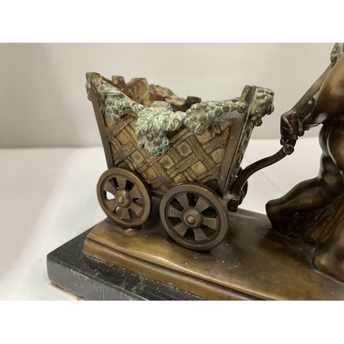 54 - A JACQUES BOUSSEAU BRONZED BOY PULLING A CART