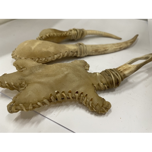 56 - THREE OLD AFRICAN VOODOO BONED RATTLES