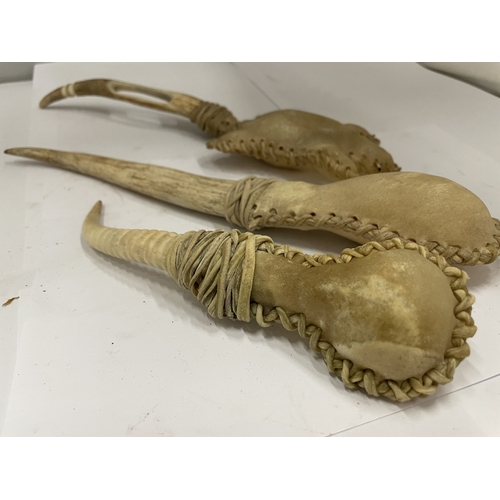 56 - THREE OLD AFRICAN VOODOO BONED RATTLES