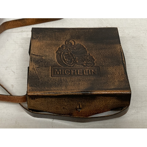 39 - A BRASS MICHELIN MAGNIFYING GLASS IN A LEATHER CASE