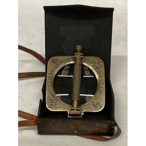 39 - A BRASS MICHELIN MAGNIFYING GLASS IN A LEATHER CASE