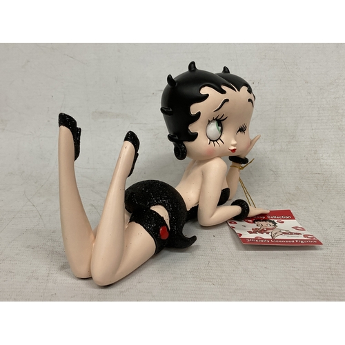 57 - A BETTY BOOP LYING DOWN FIGURE IN A BLACK DRESS