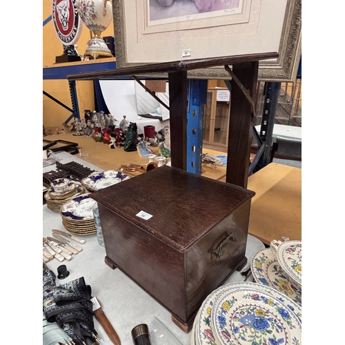 34 - A VINTAGE OAK SEWING TABLE WITH CONTENTS