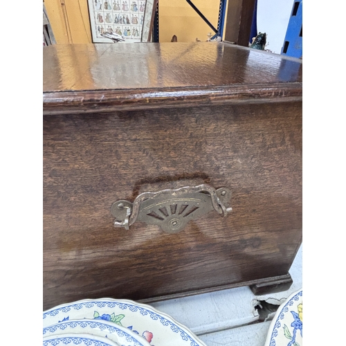34 - A VINTAGE OAK SEWING TABLE WITH CONTENTS