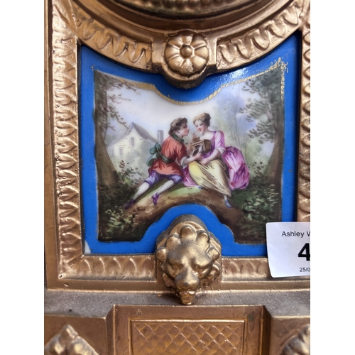 49 - AN ANTIQUE FRENCH CLOCK WITH PORCELAIN BODIED PANELS, WITH KEY AND PENDULUM, HEIGHT APPROX 42CM