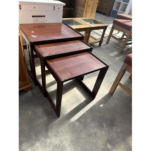 3113 - A RETRO MAHOGANY NEST OF THREE TABLES