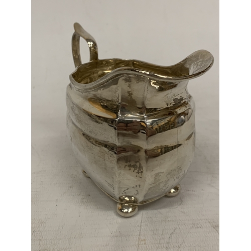 1 - A THREE PIECE HALLMARKED CHESTER SILVER TEASET TO INCLUDE A TEAPOT, CREAMER AND SUGAR BOWL - GROSS W... 