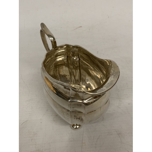 1 - A THREE PIECE HALLMARKED CHESTER SILVER TEASET TO INCLUDE A TEAPOT, CREAMER AND SUGAR BOWL - GROSS W... 