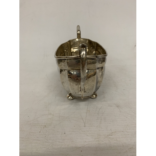 1 - A THREE PIECE HALLMARKED CHESTER SILVER TEASET TO INCLUDE A TEAPOT, CREAMER AND SUGAR BOWL - GROSS W... 
