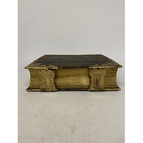 14 - A LEATHER BOUND HOLY BIBLE WITH BRASS DETAIL