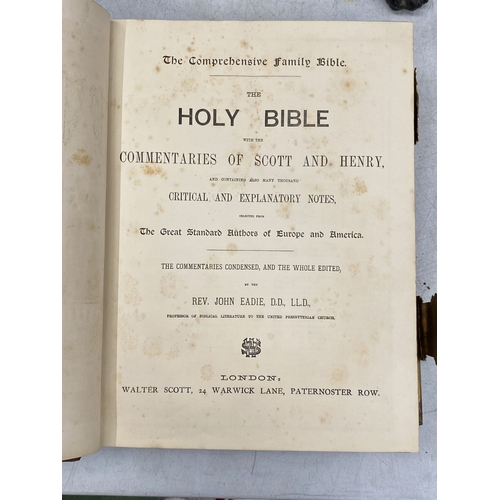14 - A LEATHER BOUND HOLY BIBLE WITH BRASS DETAIL