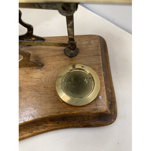16 - A SET OF VINTAGE BRASS AND WOOD POST OFFICE SCALES WITH BRASS WEIGHTS