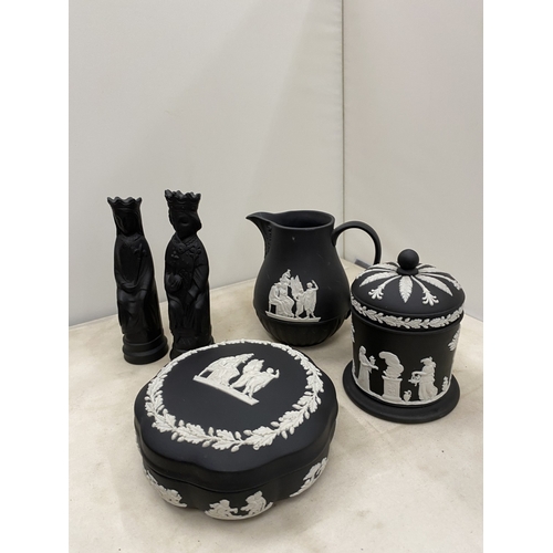 20 - A WEDGWOOD BLACK BASALT JASPERWARE CREAMER/MILK JUG TOGETHER WITH A BLACK BASALT KING AND QUEEN CHES... 