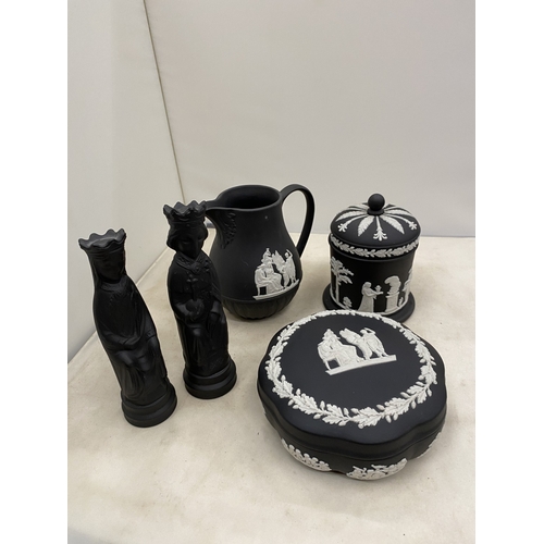 20 - A WEDGWOOD BLACK BASALT JASPERWARE CREAMER/MILK JUG TOGETHER WITH A BLACK BASALT KING AND QUEEN CHES... 