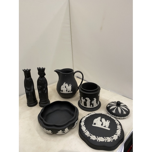 20 - A WEDGWOOD BLACK BASALT JASPERWARE CREAMER/MILK JUG TOGETHER WITH A BLACK BASALT KING AND QUEEN CHES... 