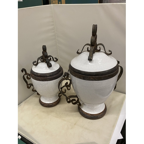 300 - TWO VINTAGE WHITE CERAMIC AND CAST IRON URNS