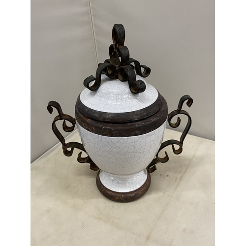 300 - TWO VINTAGE WHITE CERAMIC AND CAST IRON URNS