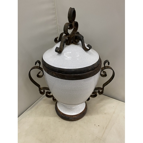 300 - TWO VINTAGE WHITE CERAMIC AND CAST IRON URNS