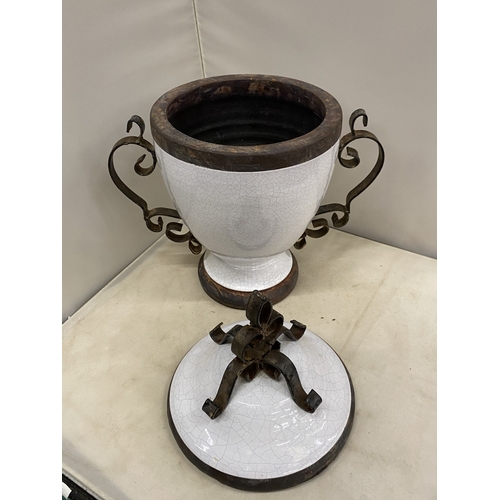 300 - TWO VINTAGE WHITE CERAMIC AND CAST IRON URNS