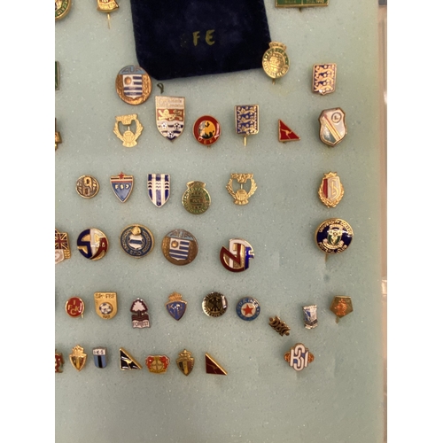 31 - A LARGE QUANTITY OF CASED ENAMELLED FOOTBALL ASSOCIATED PIN BADGES