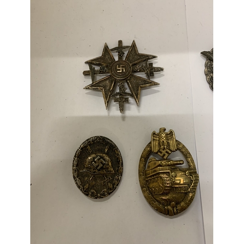 307 - A COLLECTION OF FIVE ASSORTED GERMAN WAR BADGES