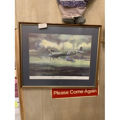 310 - A FRAMED AND GLAZED COLOURED PRINT OF A SPITFIRE, 44CM X 60CM