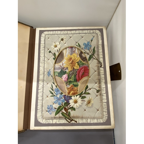 13 - A VICTORIAN LEATHER MUSICAL PHOTO ALBUM CONTAINING PHOTOS, WITH KEY (KEY IN OFFICE)