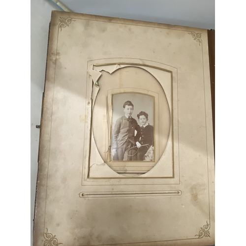 13 - A VICTORIAN LEATHER MUSICAL PHOTO ALBUM CONTAINING PHOTOS, WITH KEY (KEY IN OFFICE)