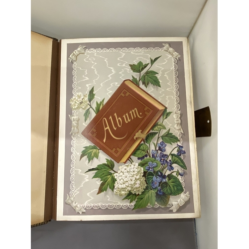 13 - A VICTORIAN LEATHER MUSICAL PHOTO ALBUM CONTAINING PHOTOS, WITH KEY (KEY IN OFFICE)