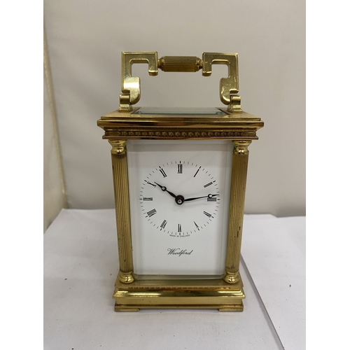 16 - A VINTAGE WOODFORD BRASS CARRIAGE CLOCK, WITH KEY, WORKING AT TIME OF CATALOGUING