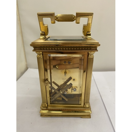 16 - A VINTAGE WOODFORD BRASS CARRIAGE CLOCK, WITH KEY, WORKING AT TIME OF CATALOGUING
