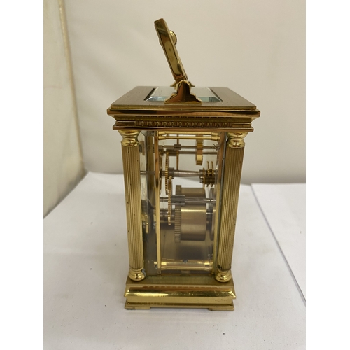 16 - A VINTAGE WOODFORD BRASS CARRIAGE CLOCK, WITH KEY, WORKING AT TIME OF CATALOGUING