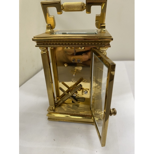 16 - A VINTAGE WOODFORD BRASS CARRIAGE CLOCK, WITH KEY, WORKING AT TIME OF CATALOGUING