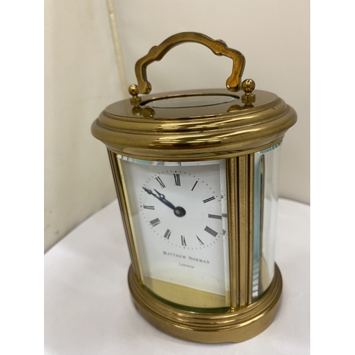 22 - A VINTAGE MATTHEW NORMAN OF LONDON, BRASS 8 DAY OVAL CARRIAGE CLOCK, WITH KEY, WORKING AT TIME OF CA... 