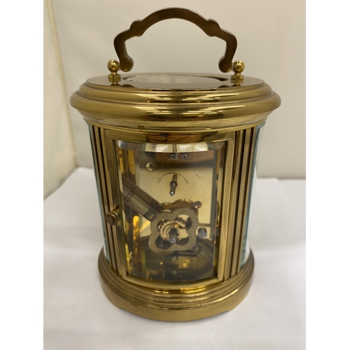 22 - A VINTAGE MATTHEW NORMAN OF LONDON, BRASS 8 DAY OVAL CARRIAGE CLOCK, WITH KEY, WORKING AT TIME OF CA... 