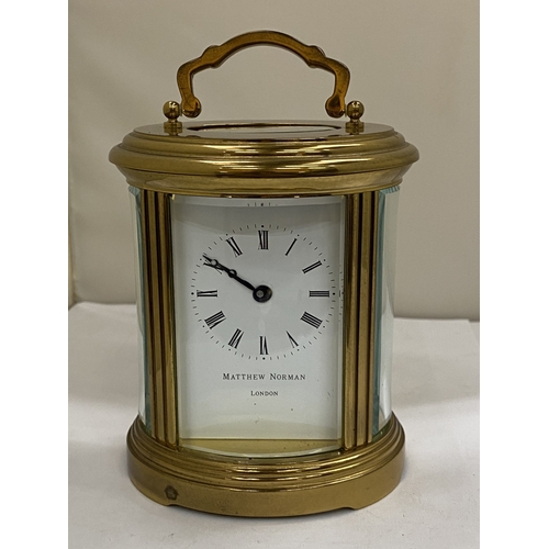 22 - A VINTAGE MATTHEW NORMAN OF LONDON, BRASS 8 DAY OVAL CARRIAGE CLOCK, WITH KEY, WORKING AT TIME OF CA... 